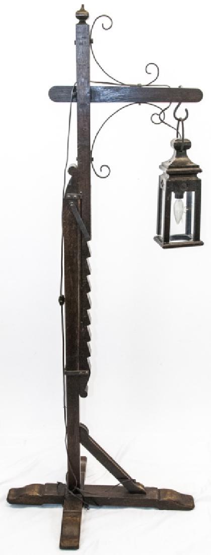 Antique Craftsman Style Indoor Standing Lantern: Antique Craftsman Style Indoor Standing Lantern. This unique antique oak indoor lantern is adjustable and has the lantern hanging pendant style off an arm of the stand. It is wired for electricity. 65