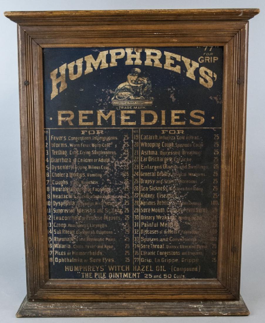 Antique Humphreys' Medicine Dispensing Cabinet: Antique Humphreys' Medicine Dispensing Cabinet. This cabinet is oak with a tin door with medicines / remedy names and the name of the malice that the remedies were to cure. 28 inches x 22 inches x 8 i