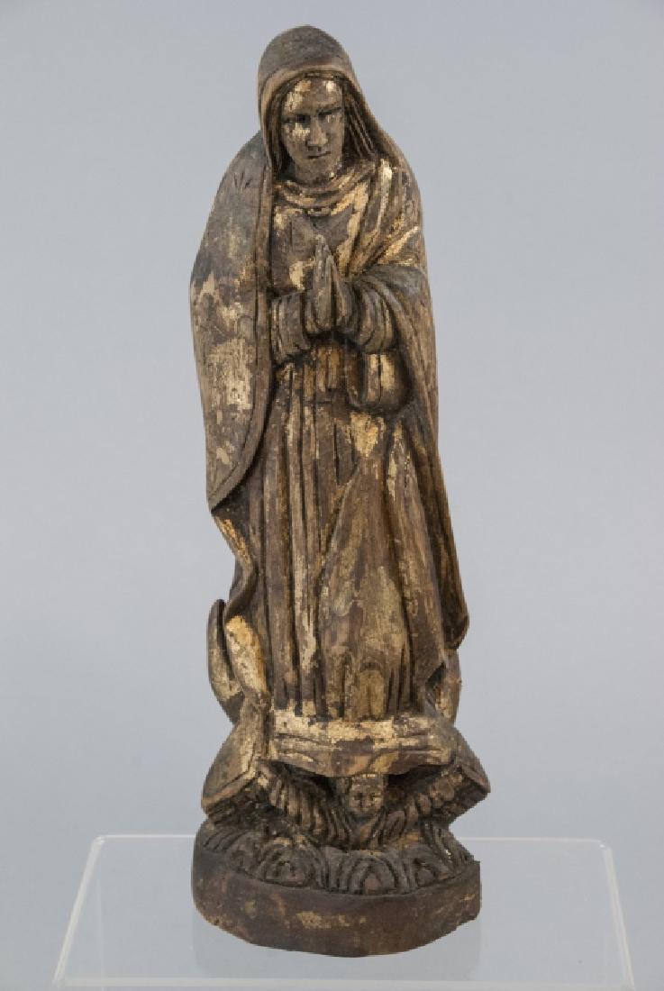 Antique Hand Carved & Gilt Decorated Santos Statue: Antique Hand Carved & Gilt Decorated Santos Statue of the Virgin Mary / Madonna. Hand carved wood with angel face at base. Measures 11.5 inches in height.