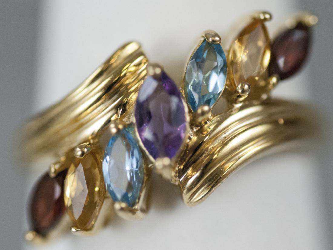 Yellow Gold Amethyst Garnet Citrine & Topaz Ring: Yellow Gold Amethyst Garnet Citrine & Topaz Ring. Set in 10kt yellow gold. Navette / marquis shaped stones. Size 7 can be resized.