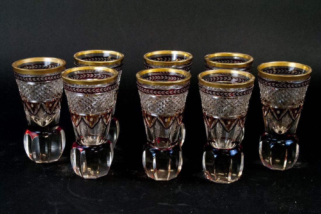 Vtg. Cut Crystal Bohemian Cocktail / Wine Glasses: Vtg. Cut Crystal Bohemian Cocktail / Wine Glasses. This lot includes eight cut crystal bohemian wine / cocktail glasses with red and gold patterned details. 6 inches x 3 inches.