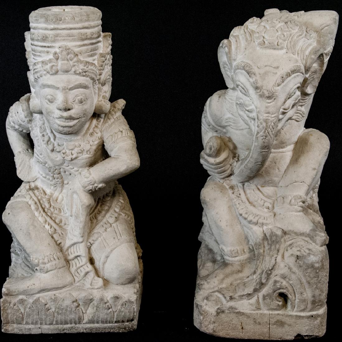 Mid Century Pair of Balinese Stone Hindu Gods: Mid Century Pair of Balinese Stone Hindu Gods. This pair of Balinese stone sitting Hindu gods feature intricate hand carved details and stylized poses. 12.5 inches x 5 inches x 6 inches.