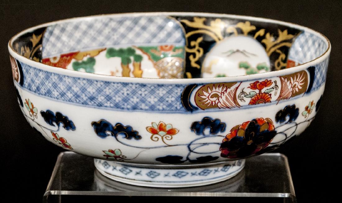 Antique Japanese Imari Porcelain Serving Bowl: Antique Japanese Imari Porcelain Serving Bowl. Lot includes one Japanese Imari porcelain serving bowl. Label reads circa 1860 from B. Altman & Company. Interior center features red and gold dragon and