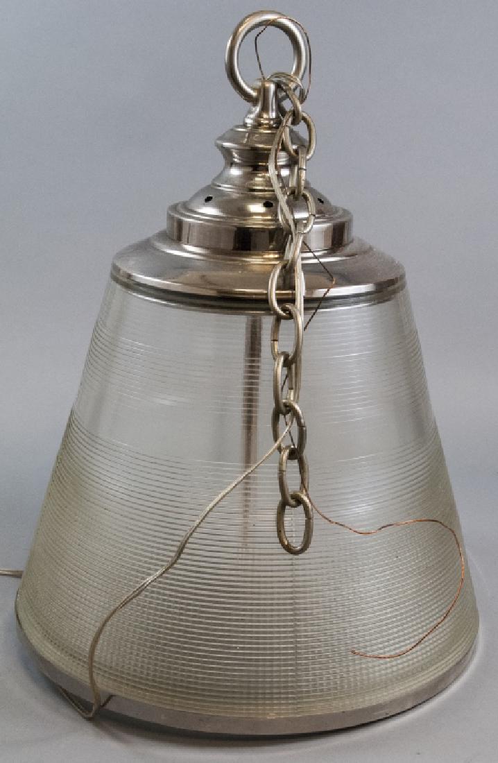 Industrial Style Modern Glass Pendent Light: Industrial Style Modern Glass Pendent Light. Very large pendent light ideal for over kitchen island. Nickel color accents on ribbed glass. Bulbs are covered. 21 inches x 15 inches in diameter