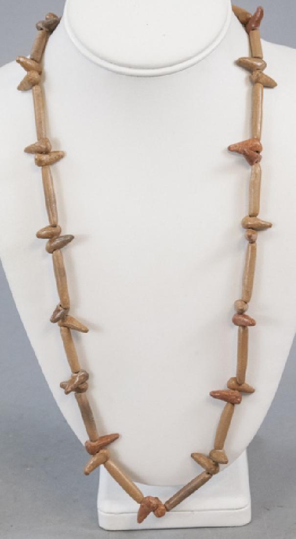 Antique African Carved Bone Trade Bead Necklace: Antique African Carved Bone Trade Bead Necklace Strand. Measures 28 inches in length.