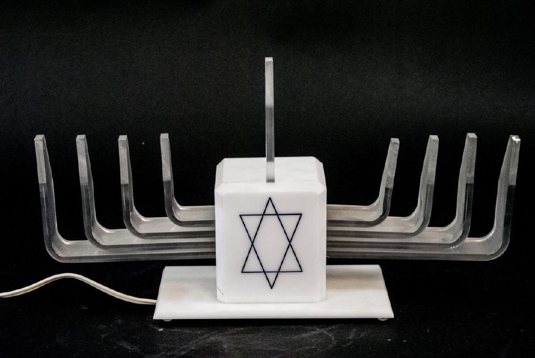 Judaica Lucite & Plastic Hanukah Menorah: Judaica Lucite & Plastic Hanukah Menorah. Measures 14.5 inches in width.