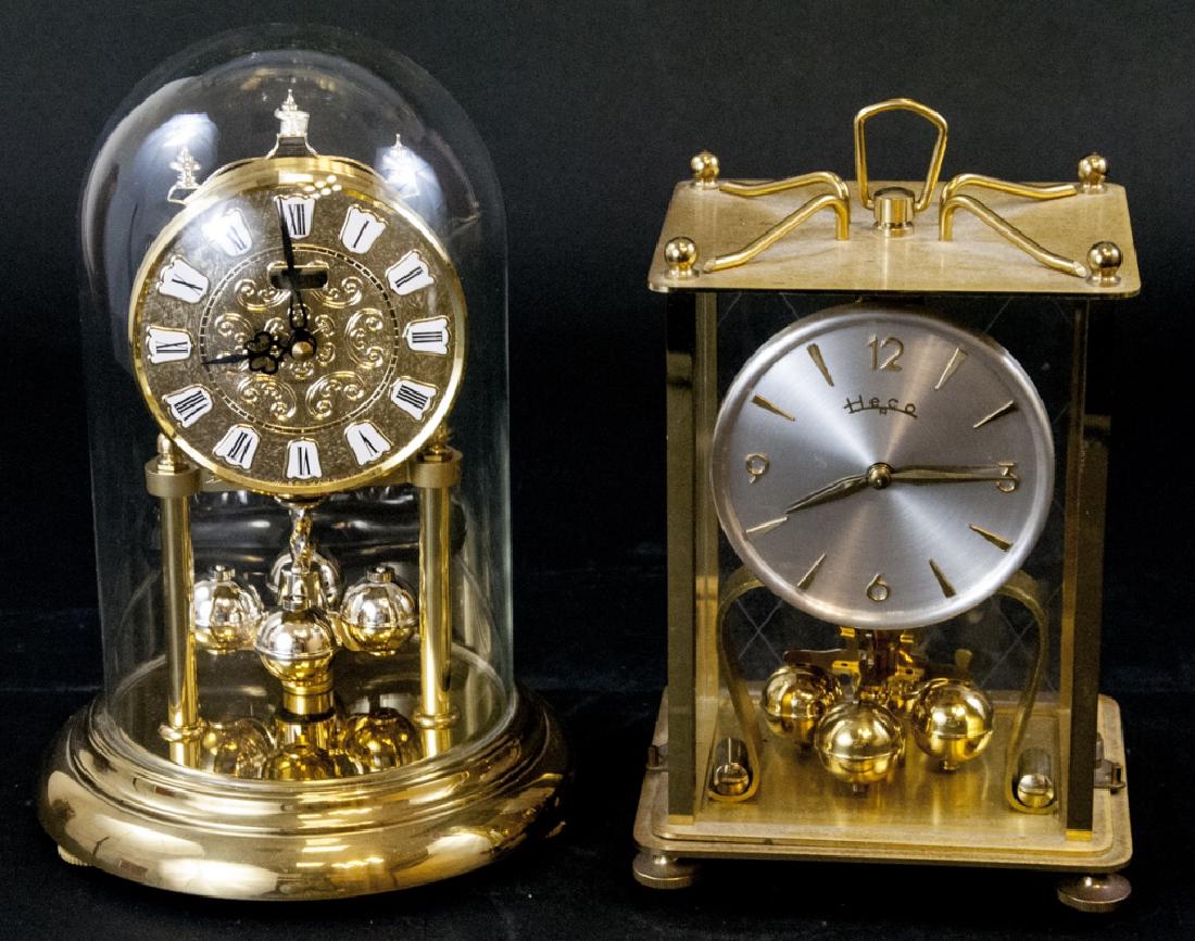 Two Vintage Anniversary / Desk Clocks: Two Vintage Anniversary / Desk Clocks. Lot includes two mixed style, period, and maker anniversary / desk clocks. Includes one clock by Linden and one clock by Heco. Largest measures 9 inches x 6.5 in