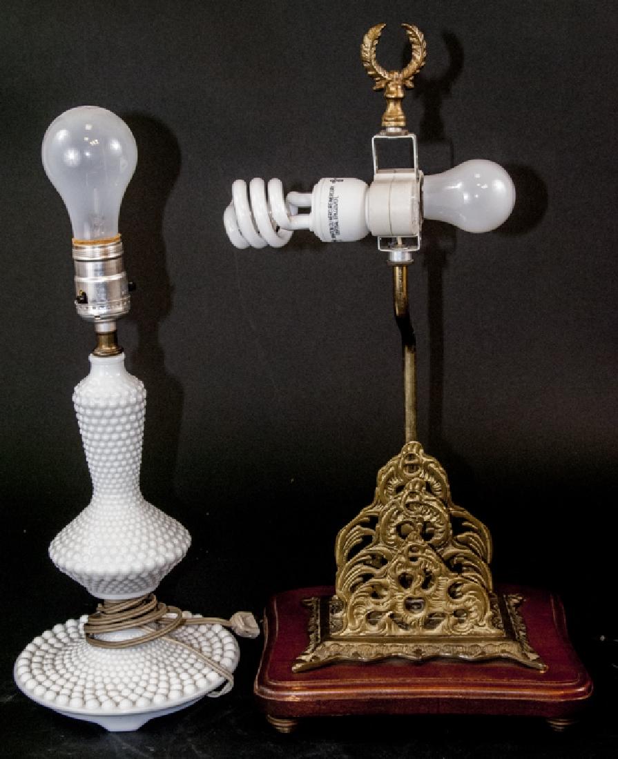 Two Antique Table Lamps: Two Antique Table Lamps. This lot includes two mixed style, period, and maker antique table lamps. Includes one white milk glass lamp and one wood & brass table lamp with double bulbs. Largest measure
