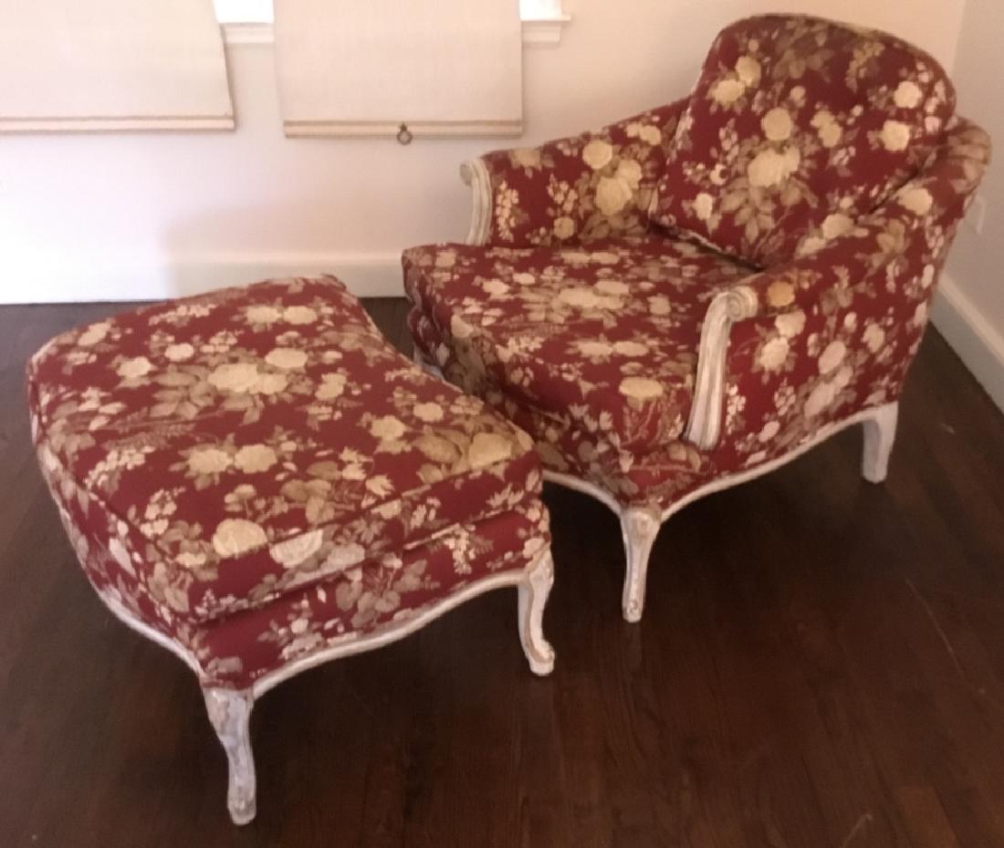 Louis XV Style Upholstered Arm Chair & Ottoman: Louis XV Style Upholstered Arm Chair & Ottoman. Featuring pickled distressed wood, cabriole legs, and rolled arms with red floral upholstery. Chair measures 29 inches x 30 inches x 31 inches. Ottoman