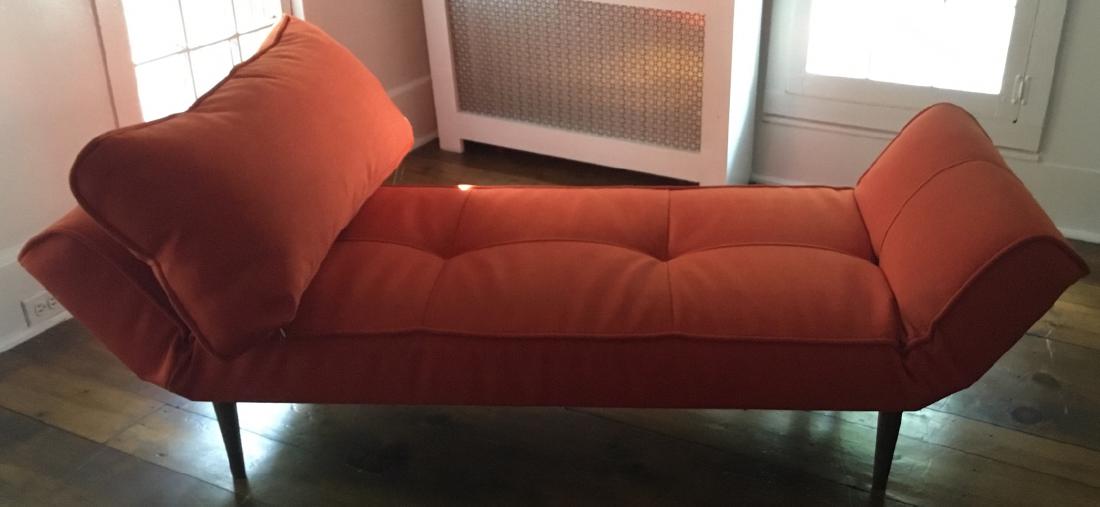 Contemporary Coral Chaise: Contemporary Coral Chaise. Contemporary or modern style coral upholstered chaise with matching pillow. 23 inches x 62 inches x 27 inches.