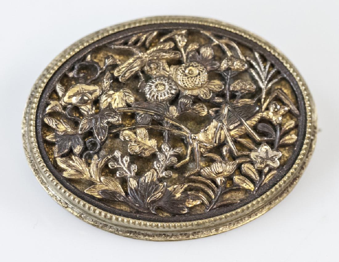 Antique 19th C Meiji Shakudo Japanese Brooch / Pin: Antique 19th C Meiji Shakudo Japanese Brooch / Pin. Japanese bronze. Incredibly well detailed scene of grasshopper, dragon fly, flowers and leaves in openwork. Measures 1.5 x 1 inch.