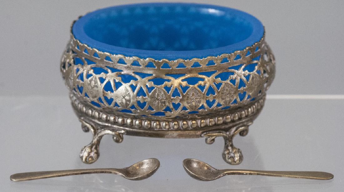 Antique English Turquoise Blue Glass Salt Cellar: Antique English Turquoise Blue Glass Salt Cellar. Consignor purchased salt cellar at the Paris flea market. Silver plate and art glass. Measures 3.5 inches in width.