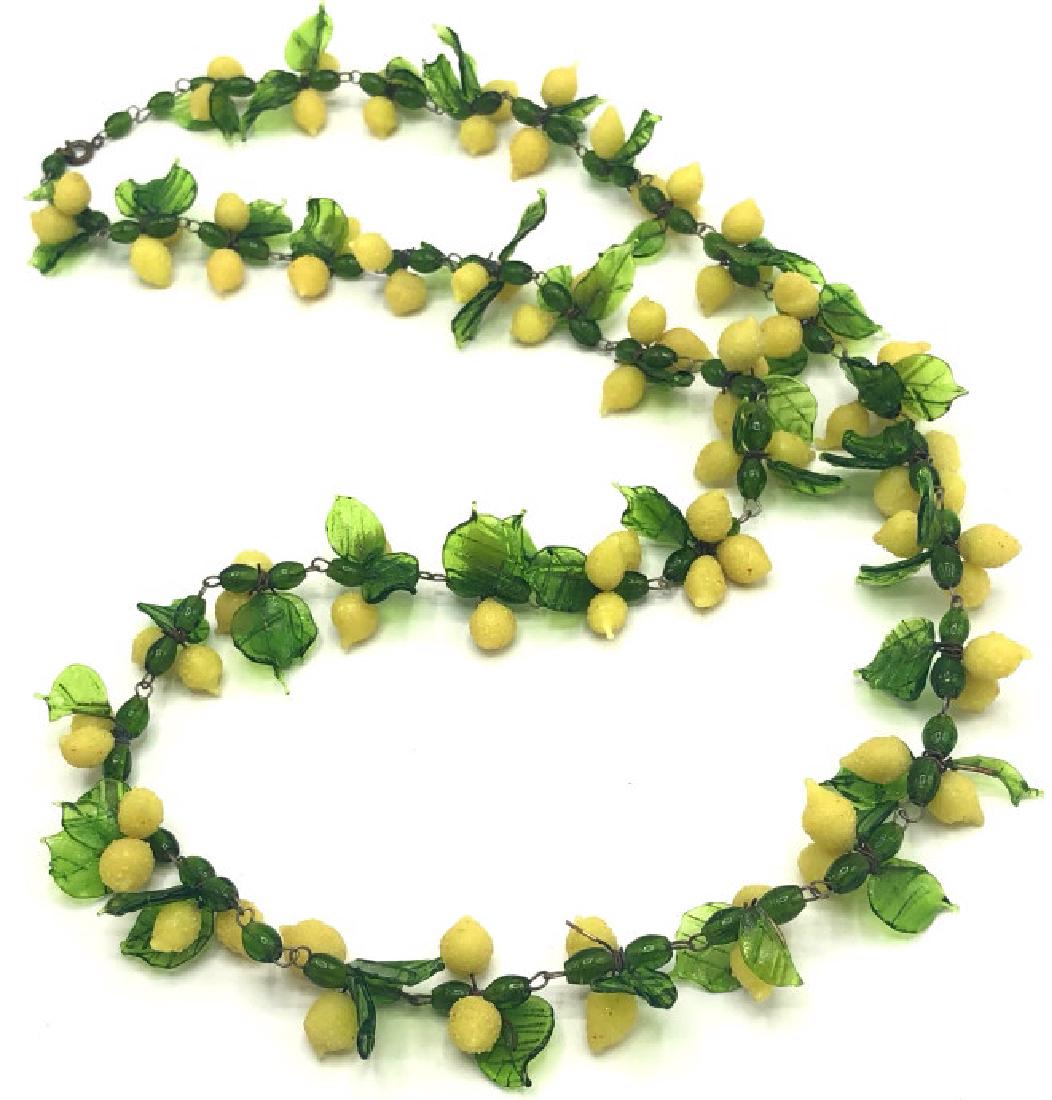 Vintage Italian Murano Glass Lemon Necklace: Vintage Italian Murano Glass Lemon Necklace. An older strand of Italian possibly Murano glass leaves and lemons strung onto pieces of wire that are looped together. About 32 inches long.