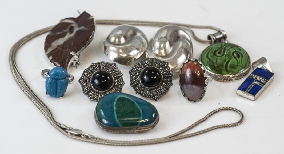 Collection of Sterling Silver Jewelry Pieces: Collection of Sterling Silver Jewelry Pieces. Including Native American. Items set with agate, pottery, lapis, marcasite and onyx.