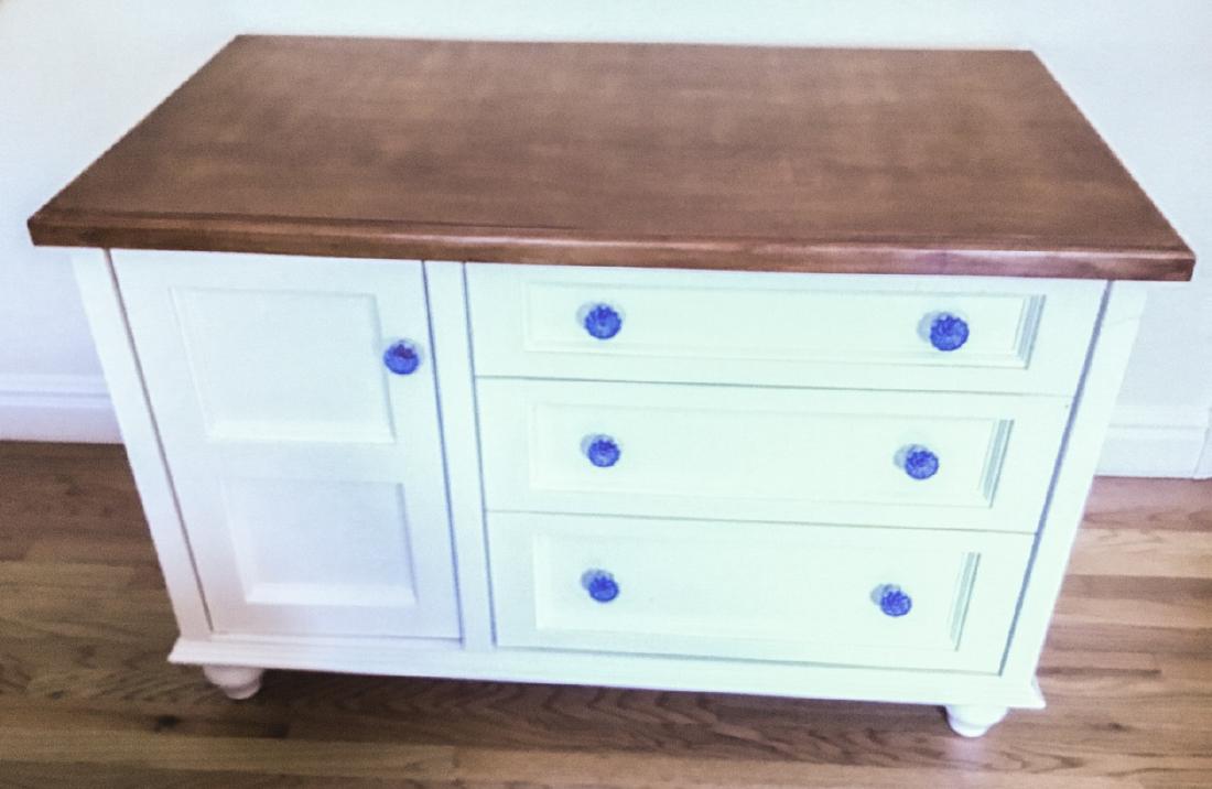 French Country Dresser: French Country Dresser. Features three drawers and one cabinet with blue crystal hardware. 30 inches x 46 inches x 25 inches.