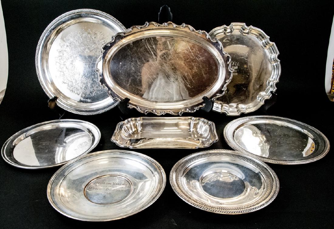 Mid Century Silver Plate Tennis Award Platters: Mid Century Silver Plate Tennis Award Platters. Lot of silver plate tennis award platters and plates dating approximately from the 1950's to the 1980's. Largest platter is 19 inches x 13 inches