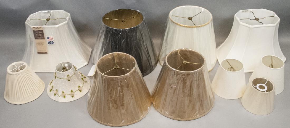 Large Lot of New Lamp Shades: Large Lot of New Lamp Shades. Mixed makers, styles, materials, and sizes. Shades are mostly unused. Largest shade is 13 inches x 17 inches diameter