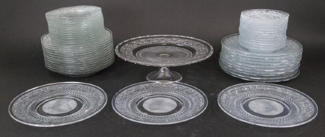 KIG Malaysia Pressed Glass Service fof 13: KIG Malaysia Pressed Glass Service fof 13. This pressed glass dinner service for 13 by BIG Malaysia features a a fleur de lis pattern. Includes 13 dinner plates, 13 lunch plates, 13 salad plates, 13 a