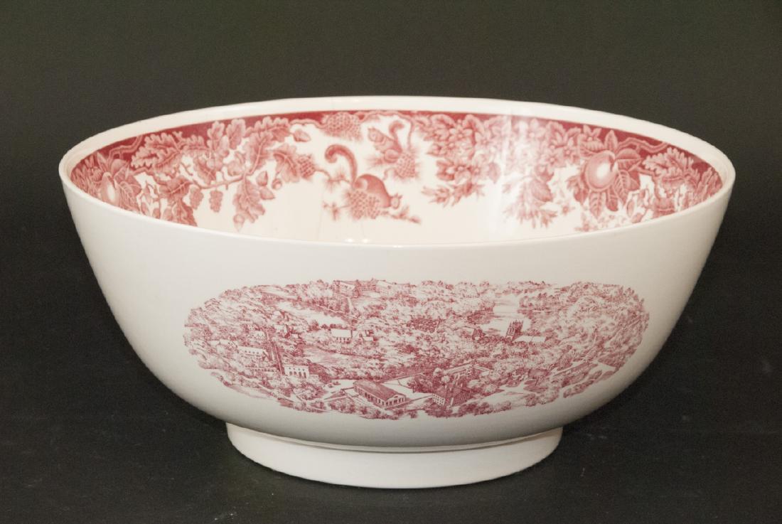 Large Wedgwood Ironstone University Bowl: Large Wedgwood Ironstone University Bowl. This large ironstone bowl by Wedgwood features views of a University and a shield with crossed sword motif. 5.5 inches x 12.5 inches.