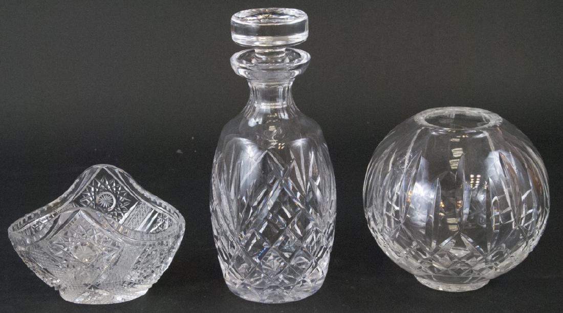 3 Cut Crystal Decorative Objects Incl. Waterford: 3 Cut Crystal Decorative Objects Incl. Waterford. Includes one decanter by Waterford, one small basket form dish and one spherical vase. Decanter measures 9 inches x 3.5 inches in diameter.