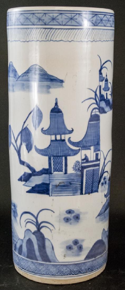 Chinese Canton Blue White Porcelain Umbrella Stand: Chinese Canton Blue & White Porcelain Umbrella Stand. This Chinese Canton blue and white porcelain umbrella stand features a river side pagoda / temple scene. 23.5 inches x 9.25 inches.
