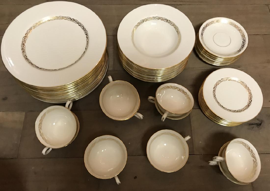 Lennox Gold & Ivory Dinner Service for 12: Lennox Gold & Ivory Dinner Service for 12. This lot includes 16 dinner plates, 12 bowls, 12 appetizer plates, 12 saucers, and 11 teacups by Lennox, each having a gold over ivory porcelain motif. Each 