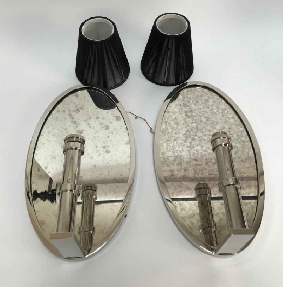 Pair Waterworks Lawson Mirrored Sconces: Pair Waterworks Lawson Mirrored Sconces. This pair of sconces by Waterworks in the "Lawson" style feature antique mirrored backs, nickel hardware, and black string shades. 14 inches x 8 inches x 4.5 i