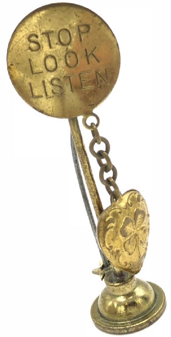 Vintage STOP LOOK LISTEN Sign Pin / Brooch W Heart: Vintage STOP LOOK LISTEN Sign Pin / Brooch W Heart. Gold filled pin is in the form of a sign with a heart charm dangling off of it. Approximately 2.5 inches tall.