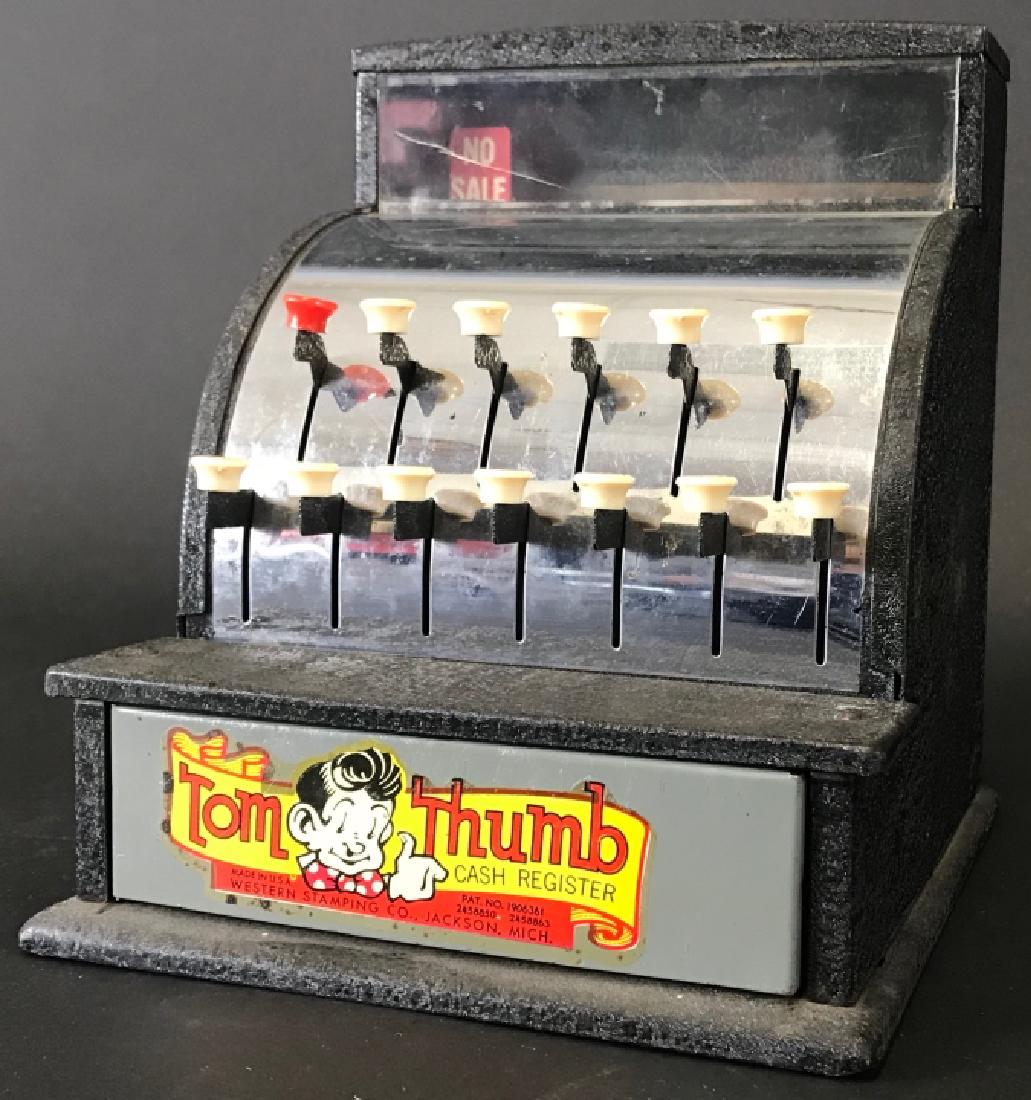 Vintage Mid Century Tin Tom Thumb Cash Register: Vintage Mid Century Tin Tom Thumb Cash Register. Child size toy cash register with working buttons and register drawer. 7.5 inches x 6.25 inches x 7 inches.