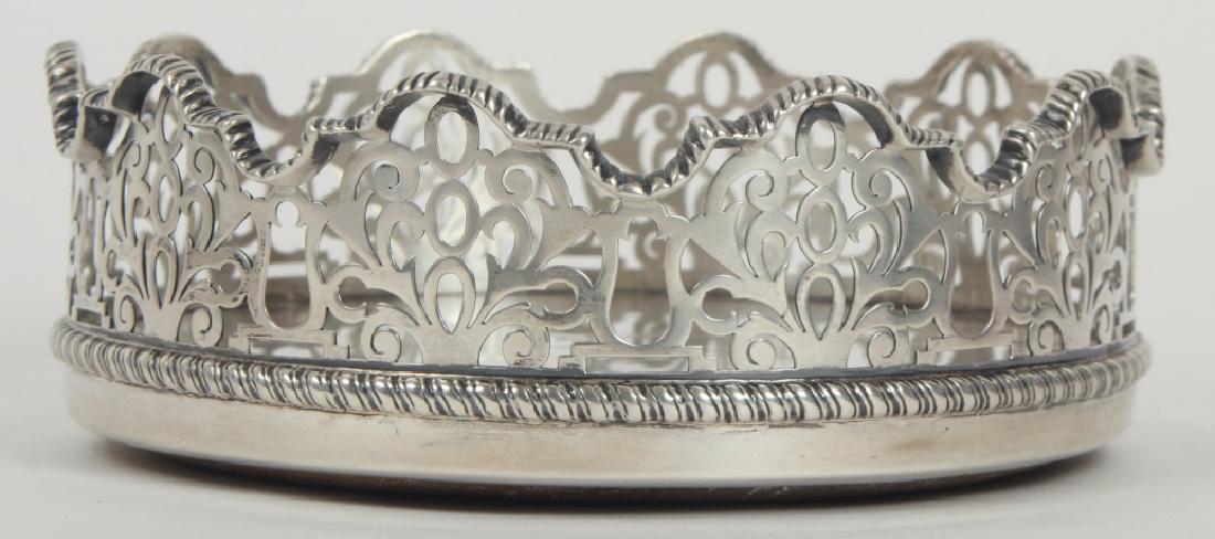 Antique Howard & Co New York Sterling Wine Caddy: Antique Howard & Co New York Sterling Wine Caddy. Wine bottle coaster. Signed / hallmarked. Having an armorial design of a stag at center. Reticulated gallery border. Measures 5.75 inches in diameter.