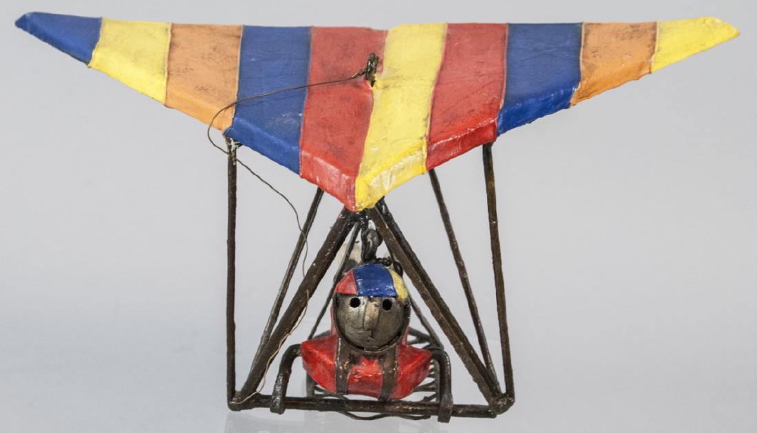 Hang Glider Sculpture Attributed Manuel Felguerez: Hang Glider Sculpture Attributed Manuel Felguerez. Folk art sculpture of a hang glider attributed to Manuel Felguerez (Mexican, b. 1928). Unsigned. .5 inches x 9 inches x 10 inches.