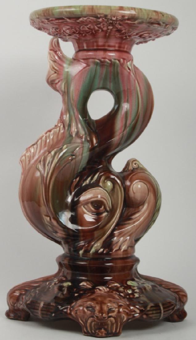 Antique Majolica Jardiniere Pedestal Plant Stand: Antique Majolica Jardiniere Pedestal Plant Stand. Having a dolphin fish motif. 21 inches x 12 inches x 12 inches.