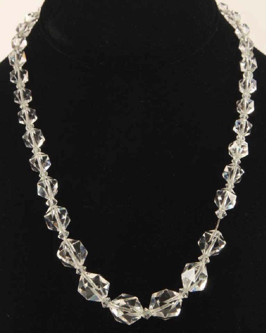 Antique Art Deco Faceted Crystal Bead Necklace: Antique Art Deco Faceted Crystal Bead Necklace. Strung on chain. Measures 19 inches in length.