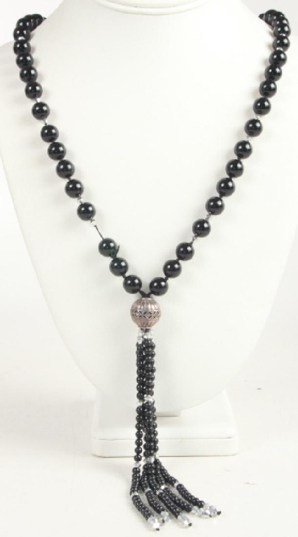Vintage Onyx Marcasite & Sterling Tassel Necklace: Vintage Onyx Marcasite & Sterling Tassel Necklace. Measures 25 inches, plus 6 inch tassel.