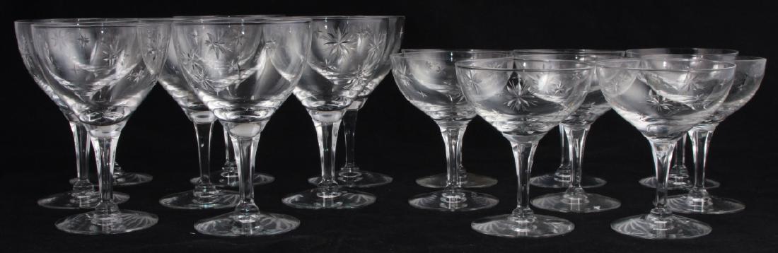 Fostoria Crystal Wine & Champagne Glasses for 8: Fostoria Crystal Wine & Champagne Glasses for 8. This lot includes eight wine and eight champagne crystal glasses by Fostoria, each featuring an etched starburst motif. All pieces are marked on the bo
