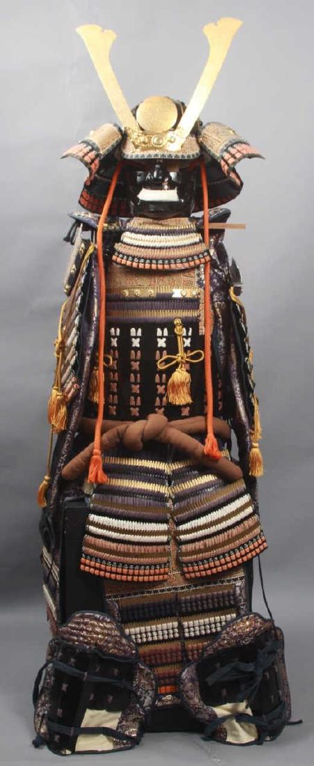 Reproduction 17th C Japanese Samurai Armor: Reproduction 17th C Japanese Samurai Armor. This reproduction 17th century Japanese samurai armor includes upper body / chest armor, head and face armor, and a display stand. Armor features brass and 