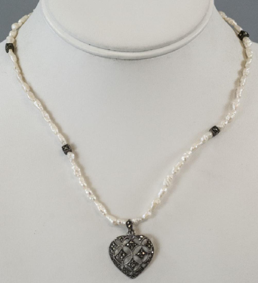 Vintage Sterling Seed Pearl & Marcasite Necklace: Vintage Sterling Seed Pearl & Marcasite Necklace. Heart pendant. Measures 16.5 inches in length, plus heart.
