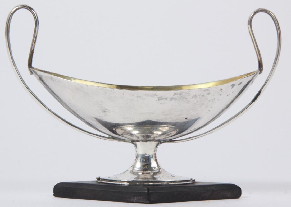 Antique Sterling Silver Urn Form Large Salt Cellar: Antique Sterling Silver Urn Form Large Salt Cellar. On wooden base with gilt wash interior. Measures 5 inches in width.