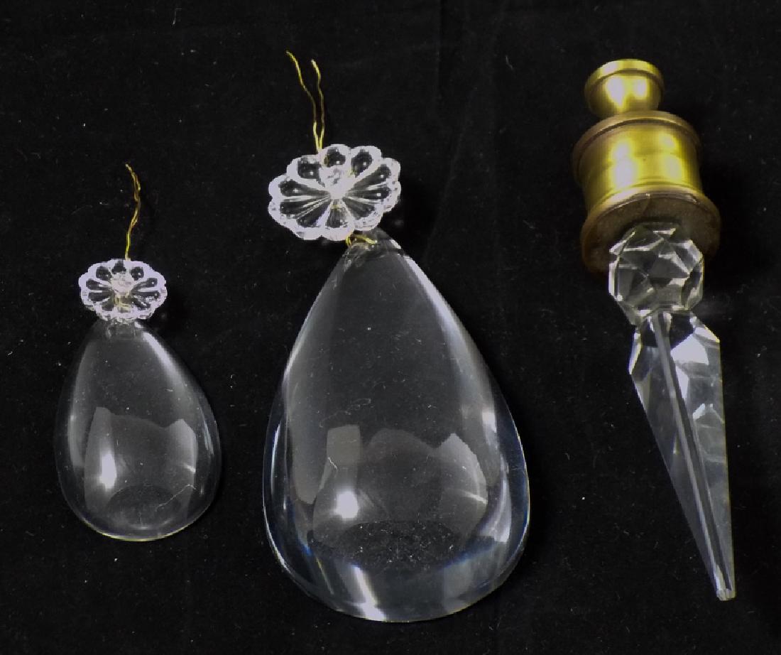 Chandelier Crystal Tear Drop Pendalogs & Finials: Lot of Chandelier Crystal Tear Drop Pendalogs & Finials. Some pendalogs have floral / rosette detail, finials have brass hardware elements. Finials measure 5.5 inches x 1 inch in diameter.
