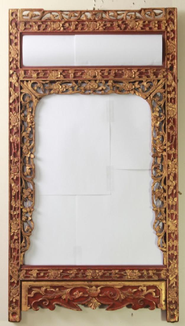 Hand Carved & Gilt Chinese Mirror: Hand Carved & Gilt Chinese Mirror. Having a wooden frame with hand carved and gilt details, double paneled mirror. Ready for hanging. 30.5 inches x 16.5 inches.