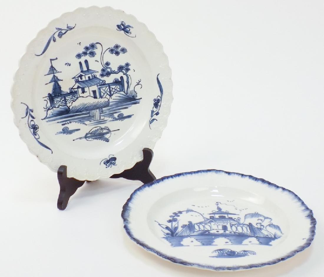 2 Chinese Canton Style Ironstone Plates: 2 Chinese Canton Style Ironstone Plates. Each feature a blue pagoda motif. Largest measures 9 inches in diameter.