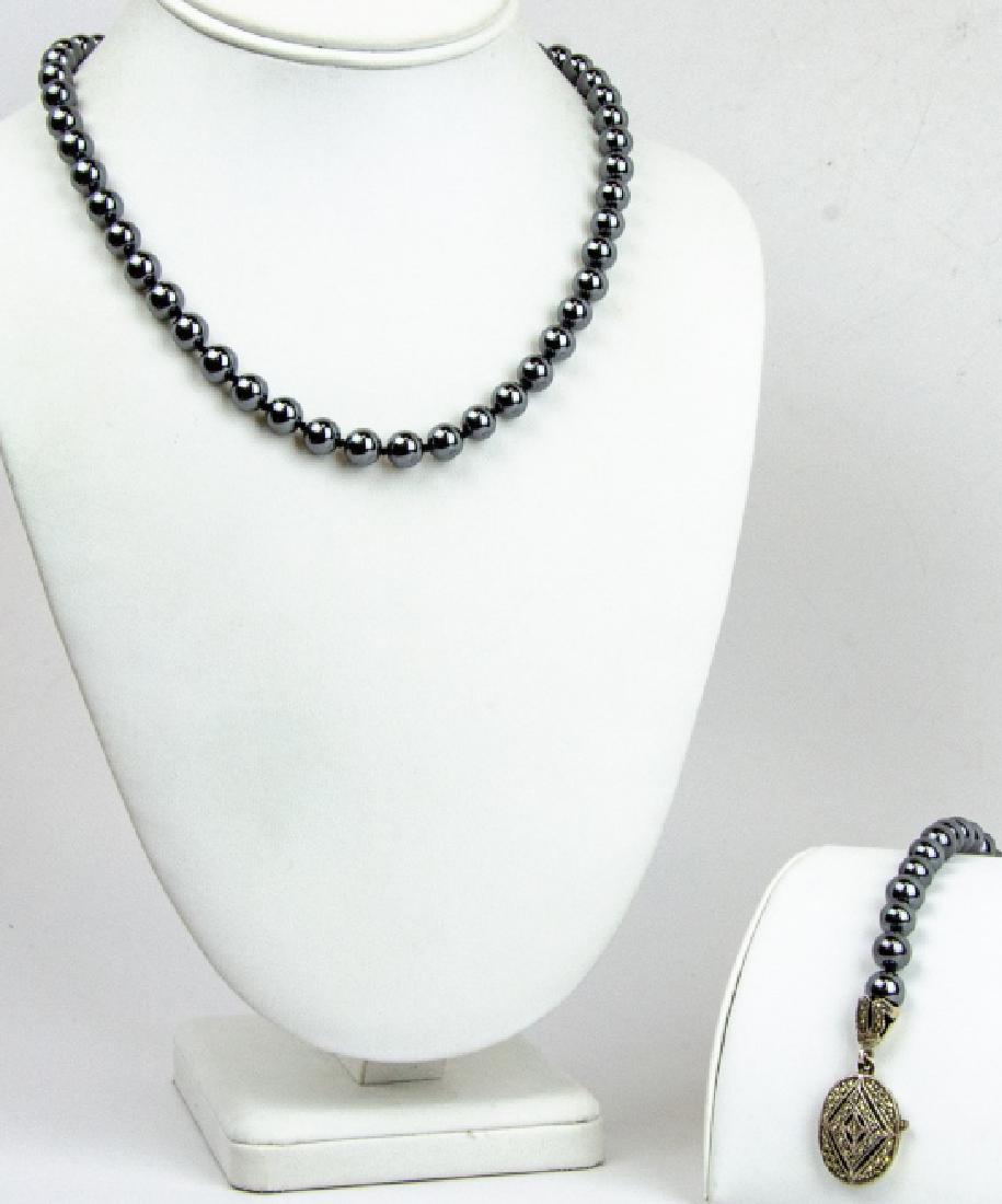 Hematite & Marcasite Sterling Silver Jewelry Set: Vintage Hematite & Marcasite Sterling Silver Jewelry Set of Necklace & Bracelet. Hand knotted. Necklace measures 18 inches in length.
