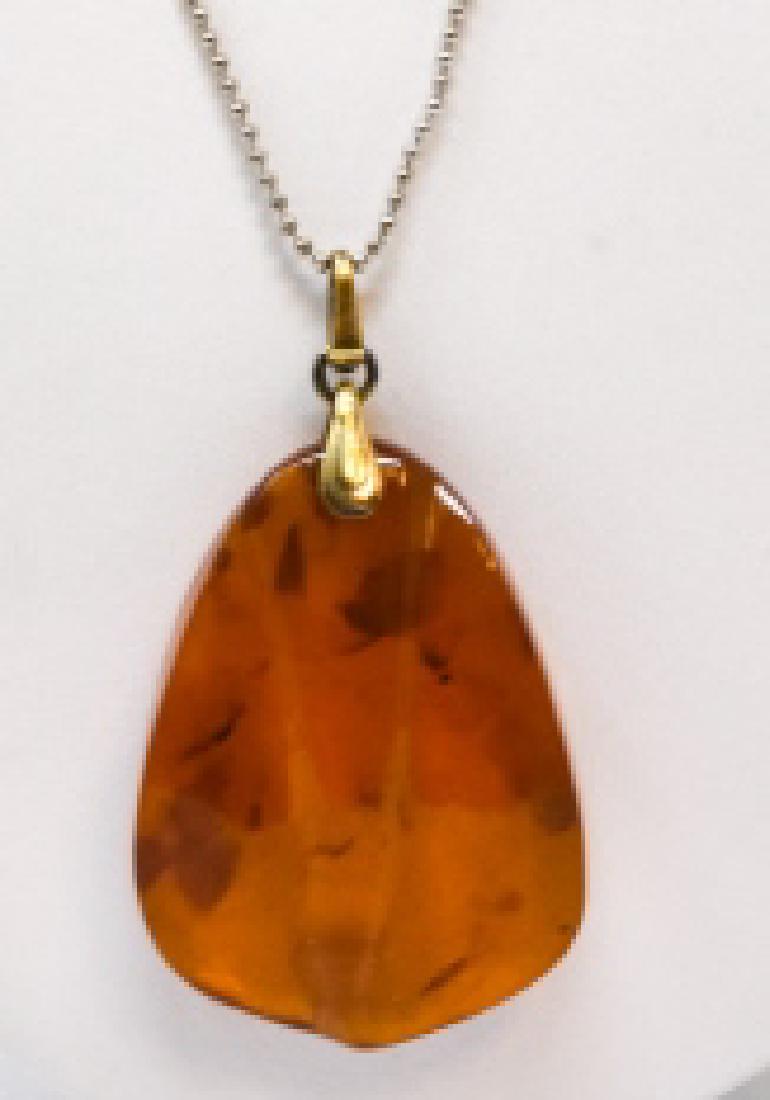 Vintage Sterling & Amber Russian Necklace: Vintage Sterling & Amber Russian Necklace. With Soviet hallmarks. Chain measures 19 inches in length, pendant measures 2.25 inches in length.