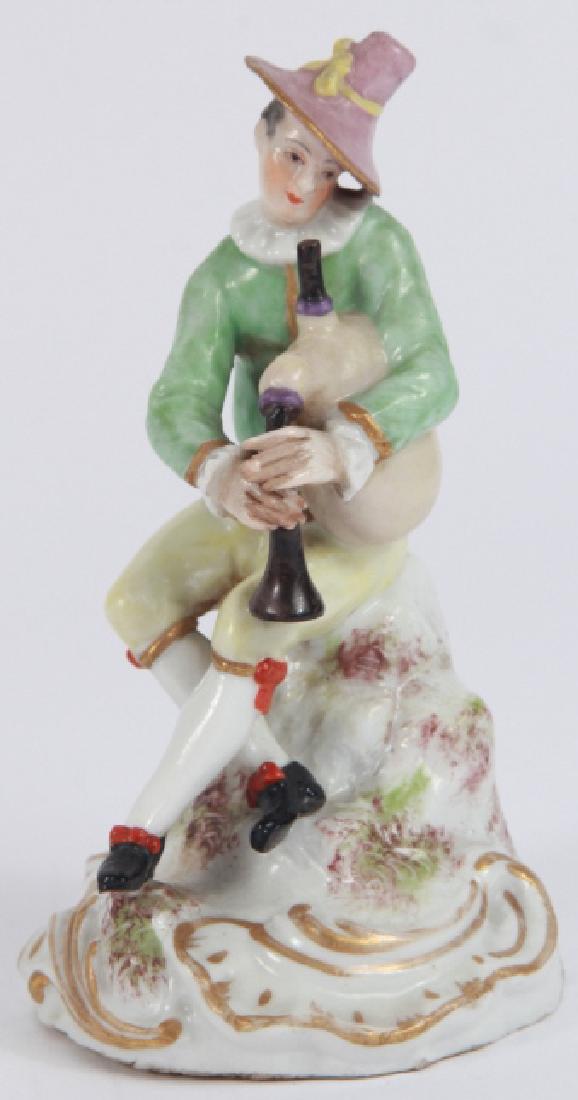 Meissen Marked Bagpipe Player Figurine: Meissen Marked Bagpipe Player Figurine. Having hand painted and gilt surface decoration. Attributed to Meissen, bears the crossed sword mark on bottom. 4.5 inches x 2.5 inches x 2.5 inches.