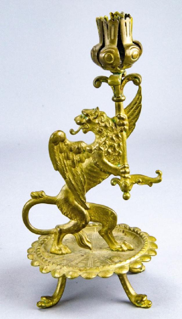 Antique 19th C Gilt Ormolu Griffin Candlestick: Antique 19th C Gilt Ormolu Griffin Candlestick. Figural ormolu candlestick with a griffin / lion. Measures 9 inches in height.