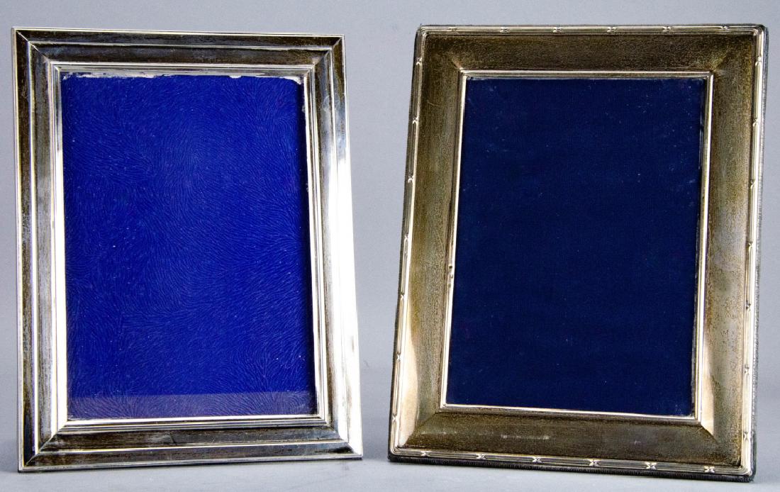 2 Sterling Silver Picture Frames: 2 Sterling Silver Picture Frames. Each features a different design. Largest measures 9 inches x 7 inches. Property of Rye, NY estate.