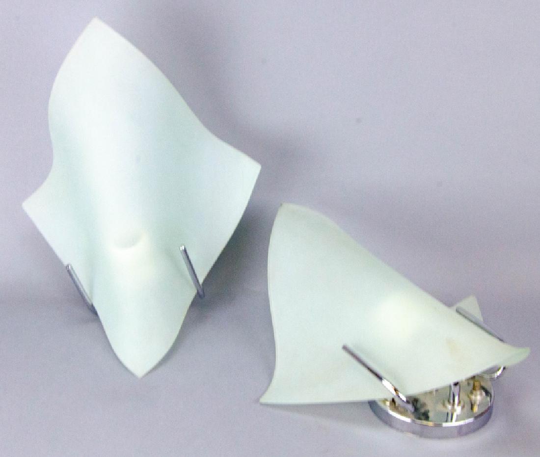 Pair Contemporary Chrome & Frosted Glass Sconces: Pair Contemporary Chrome & Frosted Glass Sconces. Each sconces allows for one light. Label on reverse reads "Boyd Lighting Company". 13.5 inches x 10.5 inches x 10 inches.