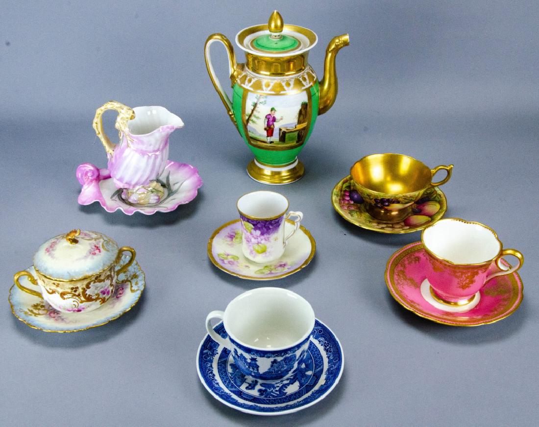 Collection of Antique Porcelain Tea Serveware: Collection of Antique Porcelain Tea Serveware. Includes one teapot, one lidded sugar bowl with saucer, and five teacups with matching saucers. Includes French, English, and Bavarian pieces. Teapot mea