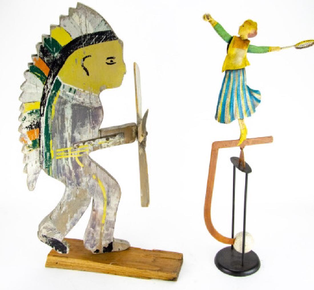 2 Vtg Hand Made Figural Yard / Outdoor Decorations: 2 Vintage Hand Made Figural Yard / Outdoor Decorations. Includes one figural hand painted and carved wood Native American decoration and one enameled wrought iron tennis player decoration. Largest mea