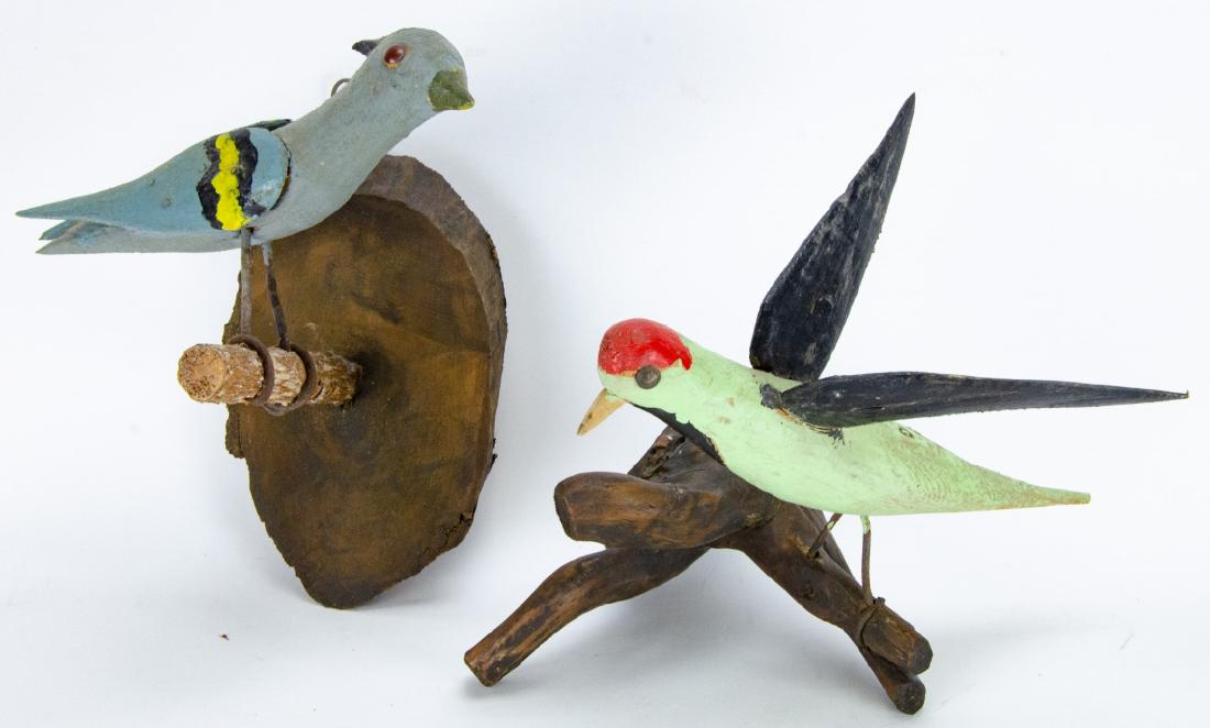 Pair Arts & Crafts Style Hand Carved Mounted Birds: Pair Arts & Crafts Style Hand Carved Mounted Birds. Hand carved and painted wooden bird decorations mounted for wall hanging. Largest measures 10 inches x 5 inches x 8 inches.